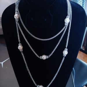 Long silver braided necklace with pearl accents
